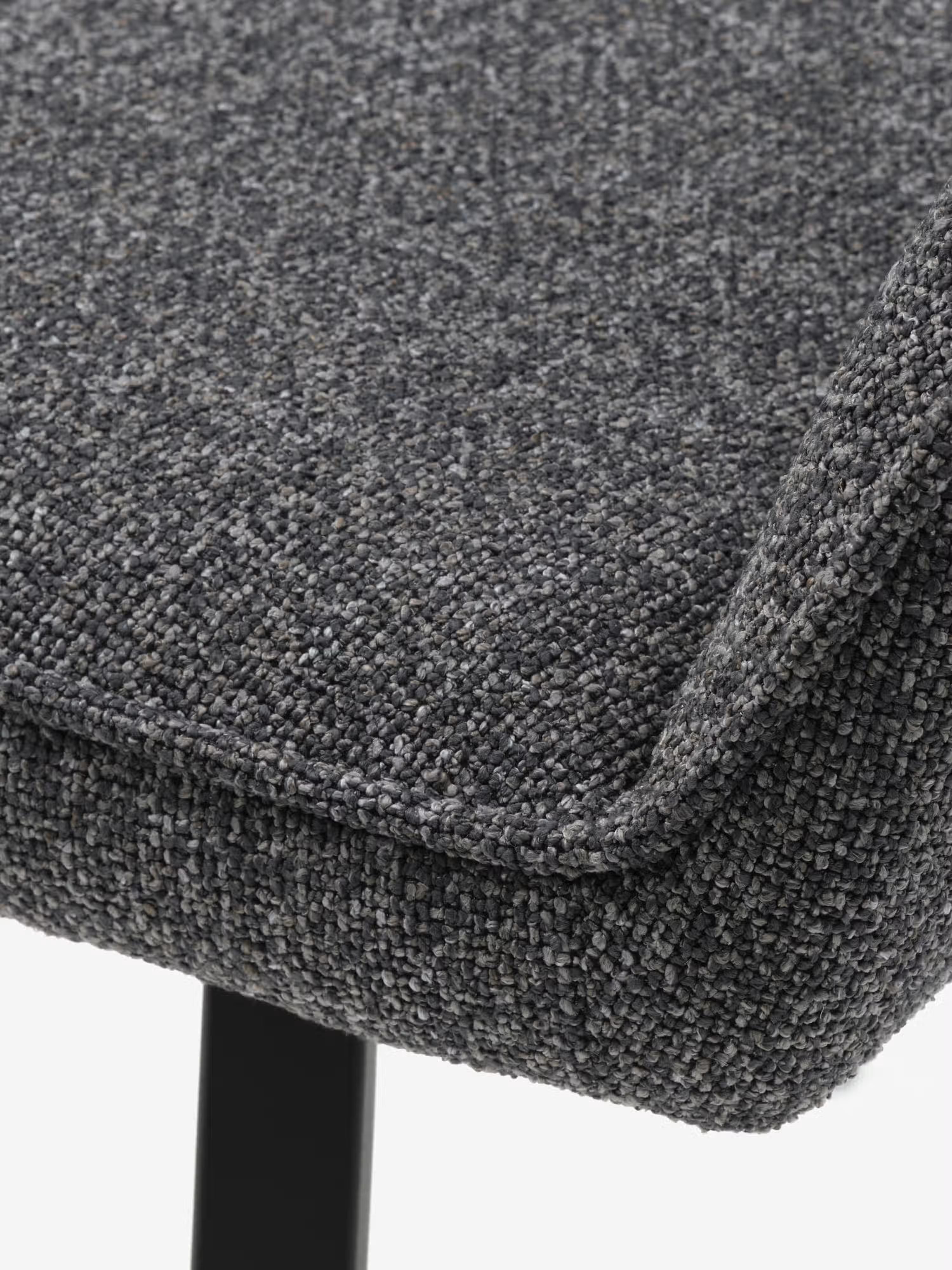 Alma silla giratoria tapizada en tela bouclé melange con base de metal negro