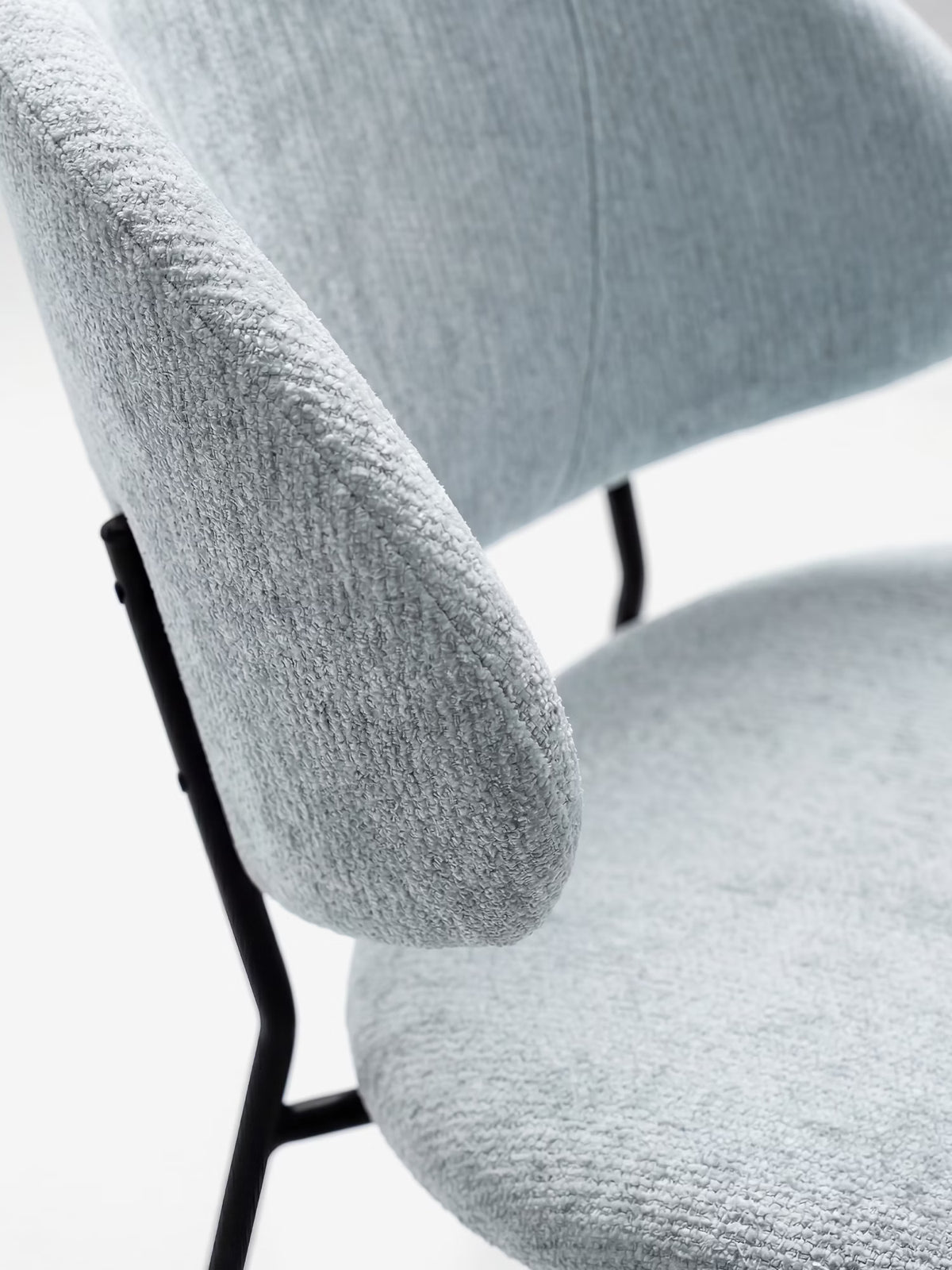 Bruma chair in elegant grey fabric with black metal legs - minimalist design and wraparound backrest