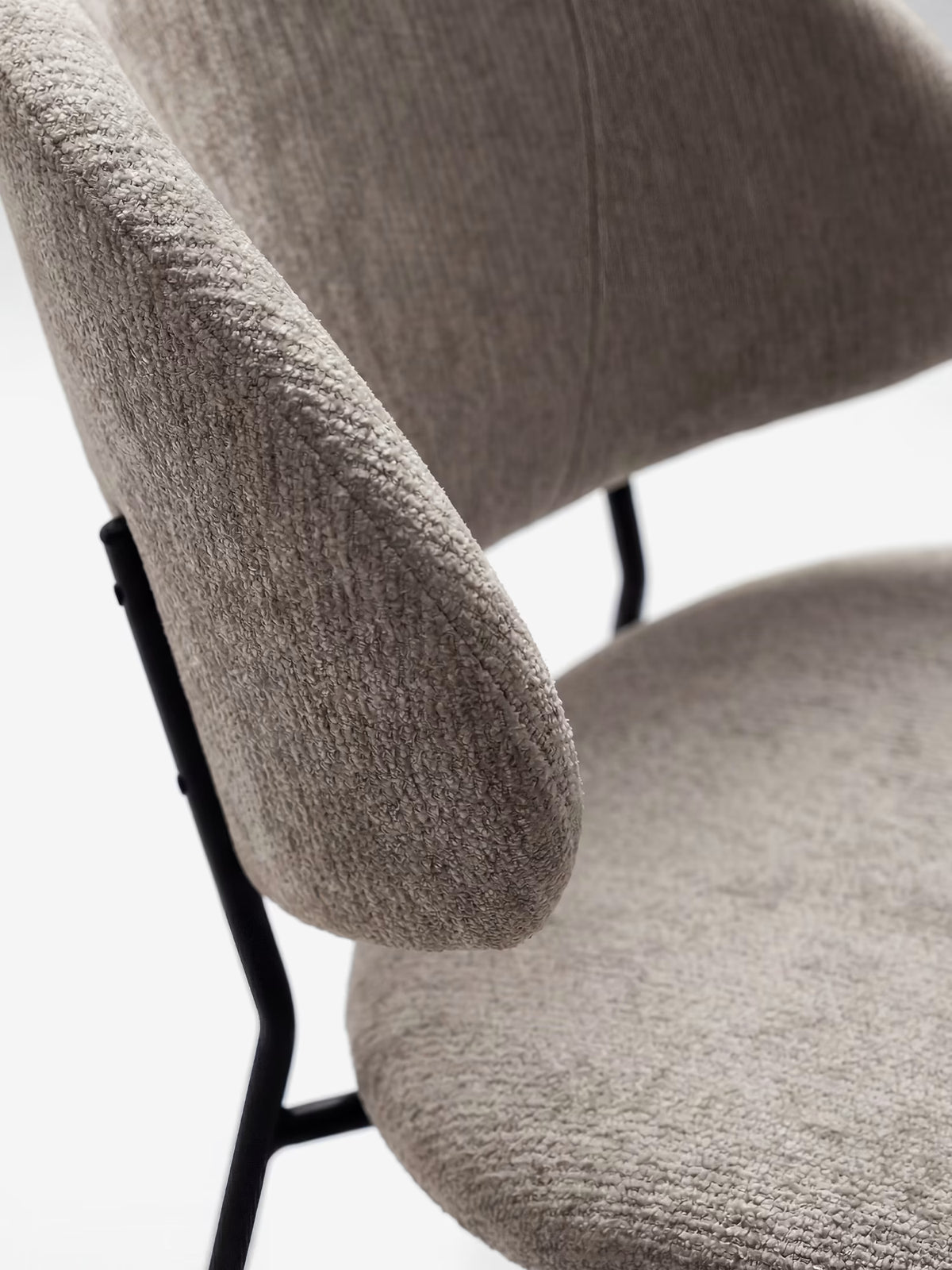 Bruma chair in elegant grey fabric with black metal legs - minimalist design and wraparound backrest