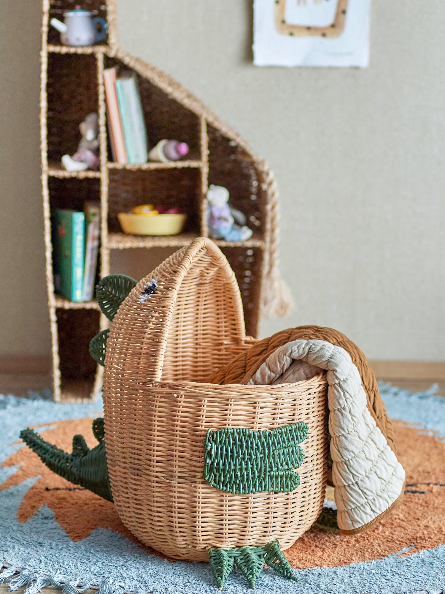 Eddi Natural rattan storage basket shaped like a dinosaur