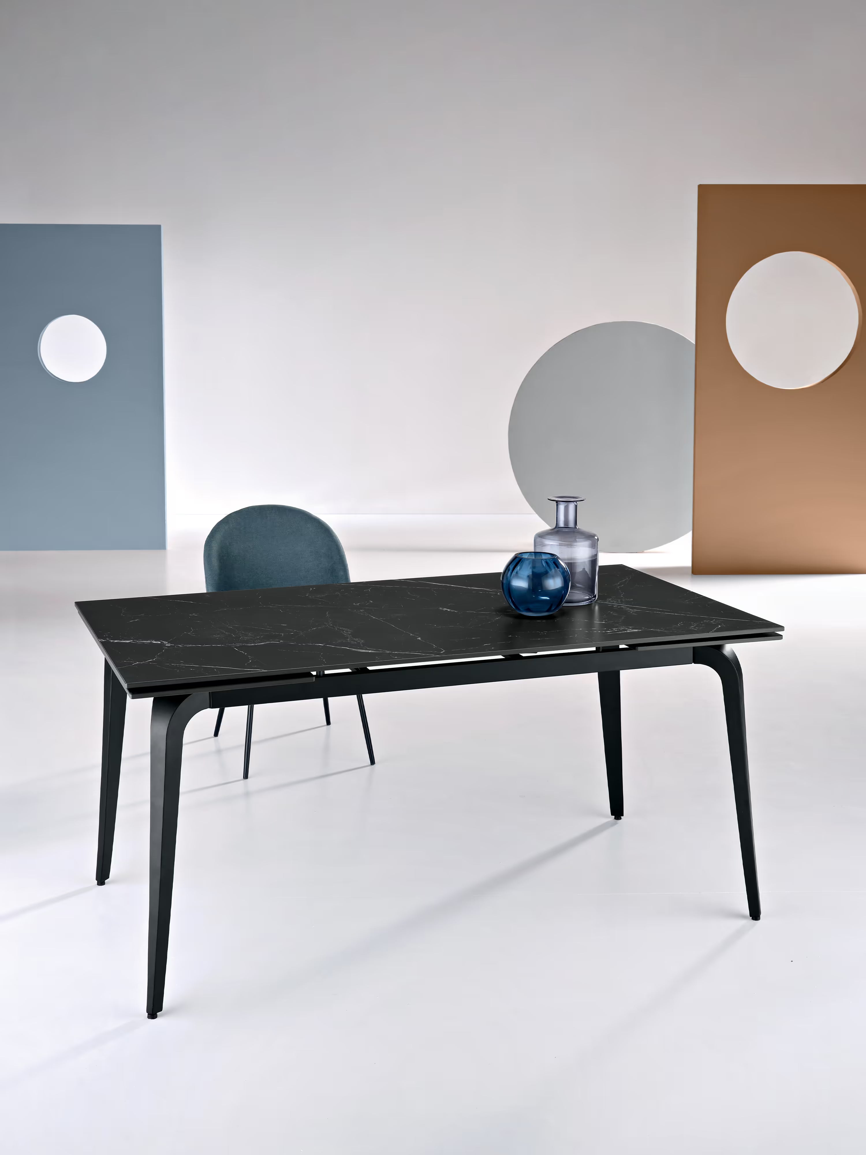 Felix extendable matte black marble table – black metal base seating 6 to 10