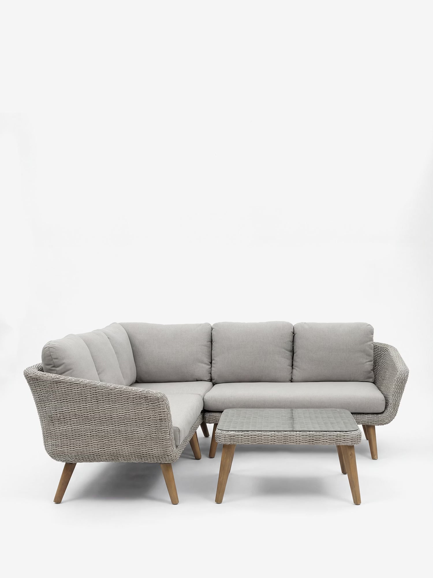 Leya Set angolare da esterno in wicker grigio con tavolino con top in vetro temperato