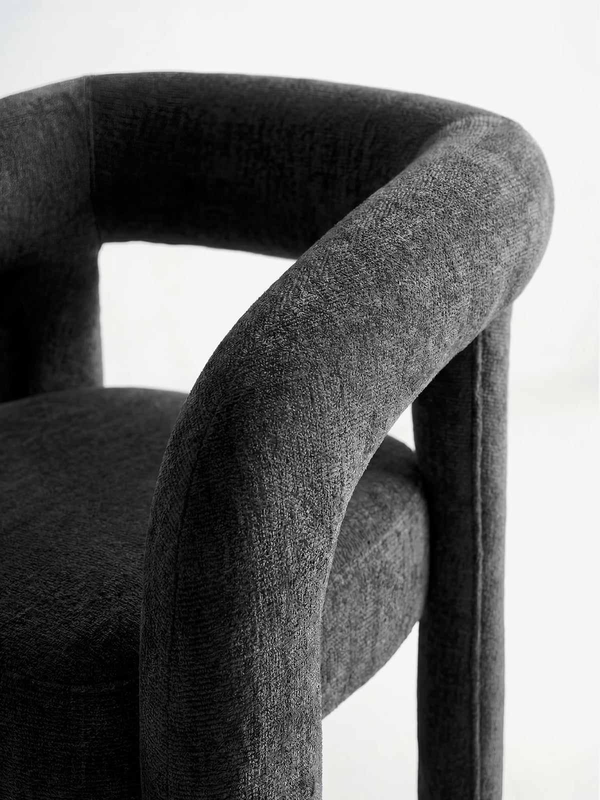 Sibilla upholstered green chenille fabric designer chair with upholstered frame and arch shape