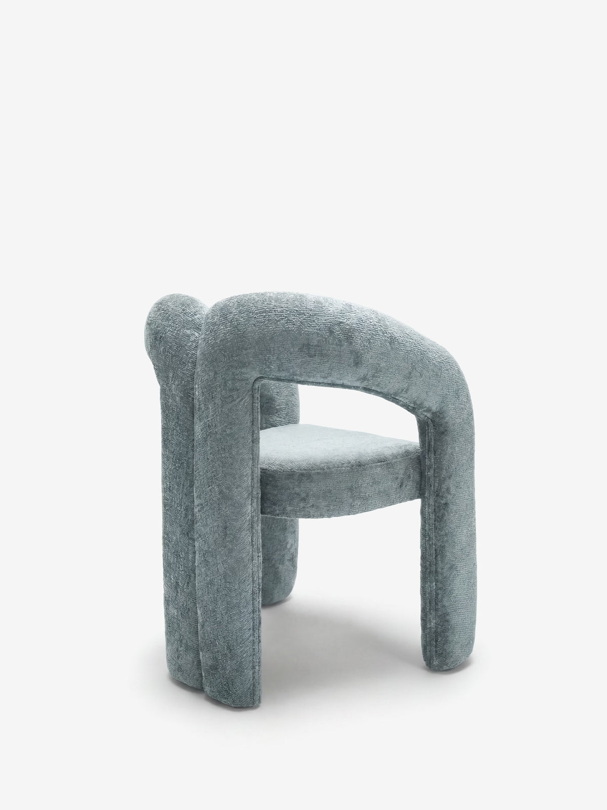 Sibilla upholstered green chenille fabric designer chair with upholstered frame and arch shape