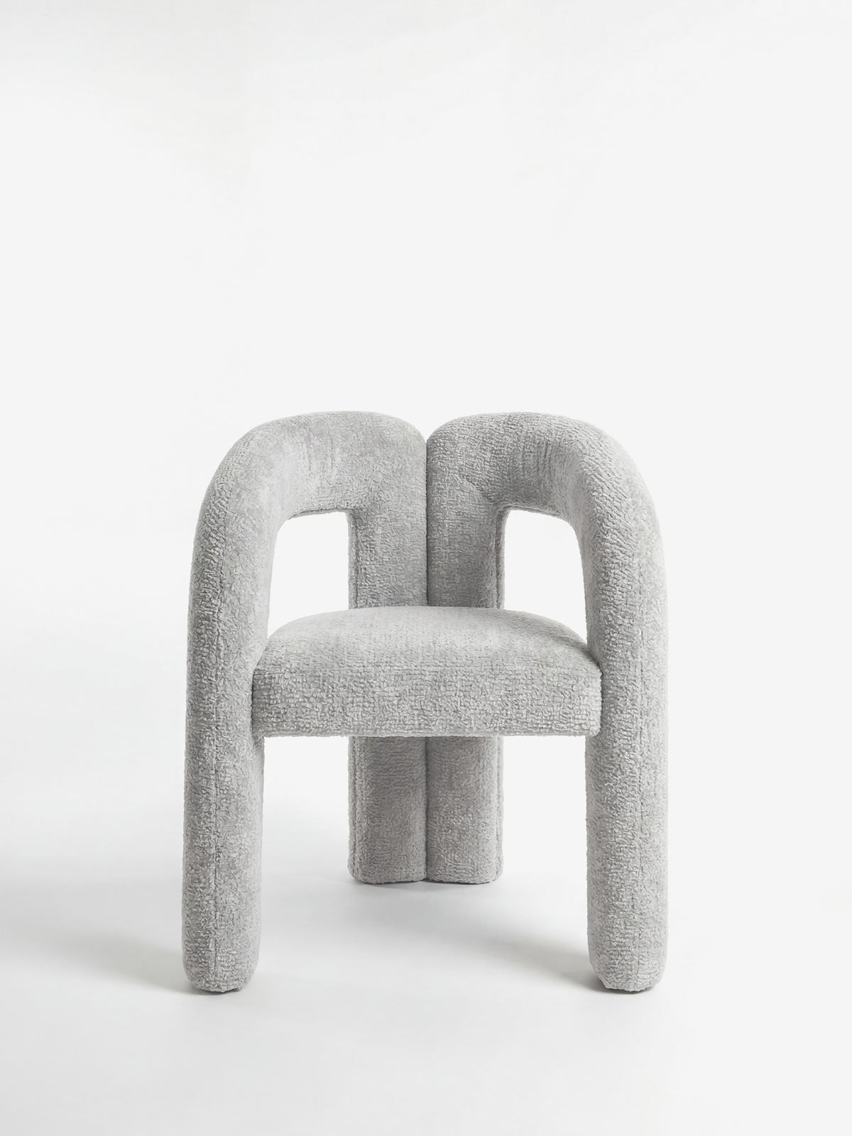 Sibilla upholstered green chenille fabric designer chair with upholstered frame and arch shape