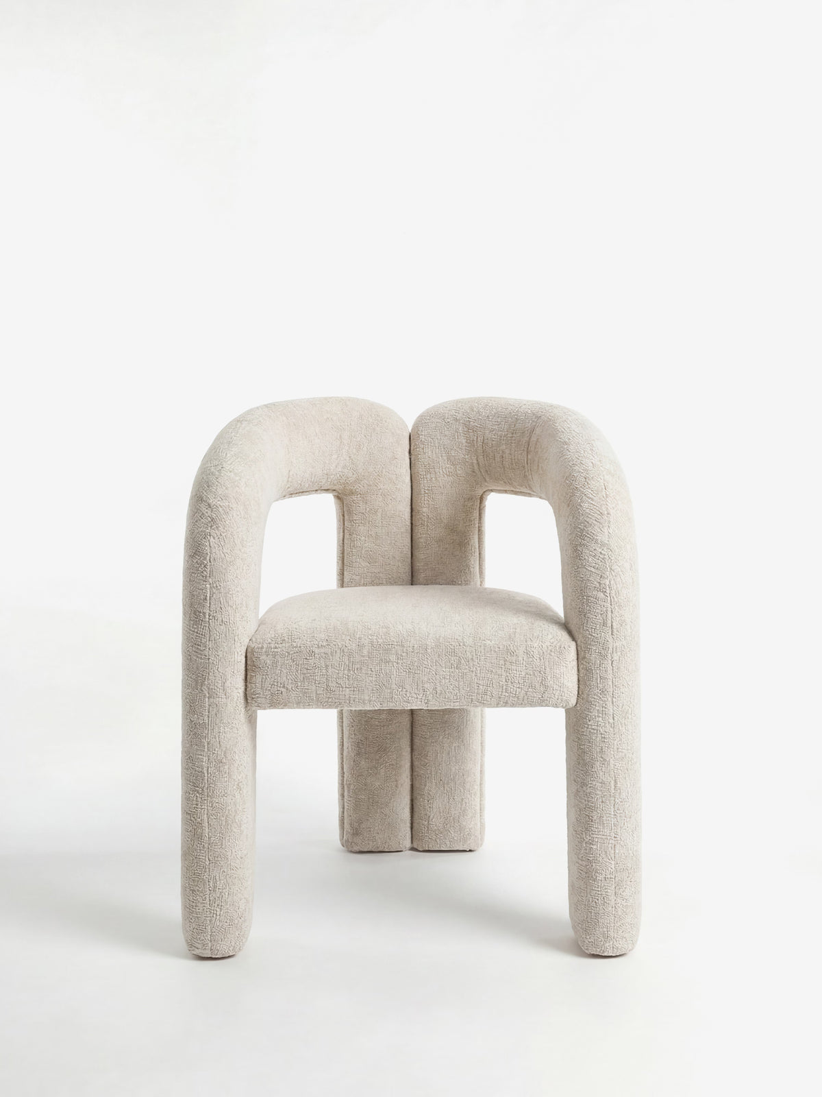 Sibilla upholstered green chenille fabric designer chair with upholstered frame and arch shape