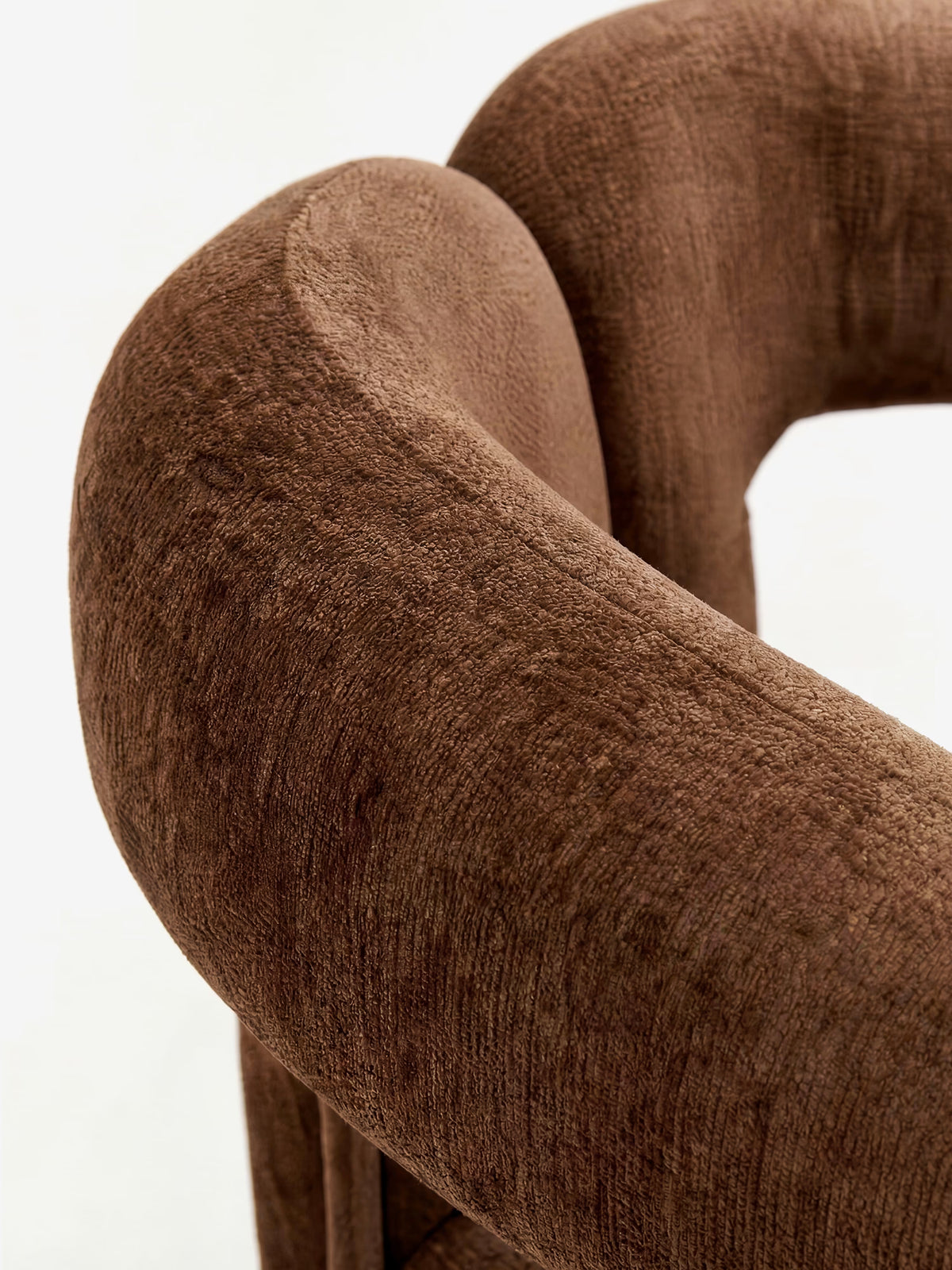 Sibilla upholstered green chenille fabric designer chair with upholstered frame and arch shape