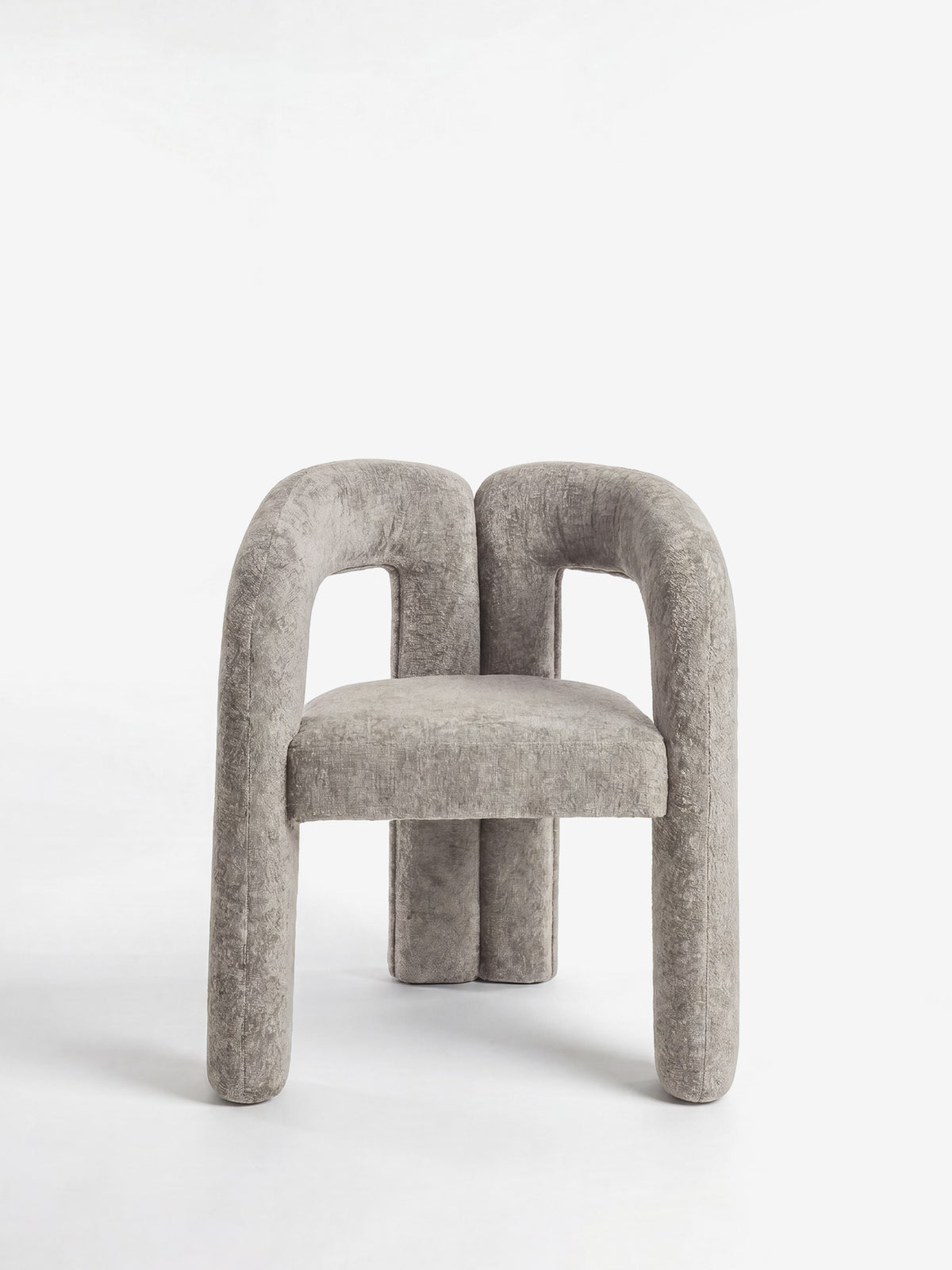 Sibilla upholstered green chenille fabric designer chair with upholstered frame and arch shape