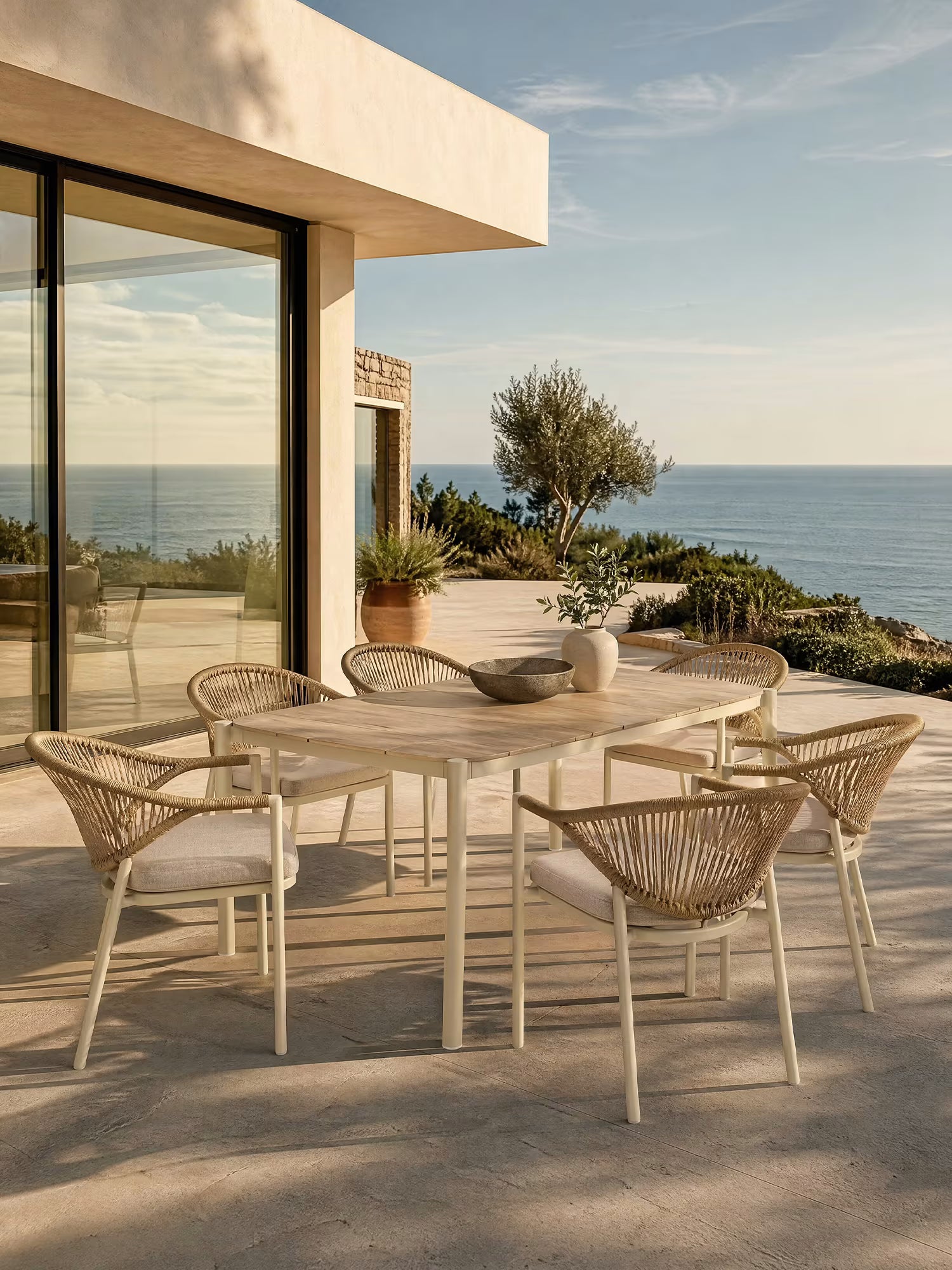 Abela conjunto de comedor de exterior con mesa rectangular 100x200 cm y 6 sillas de aluminio y ratán natural