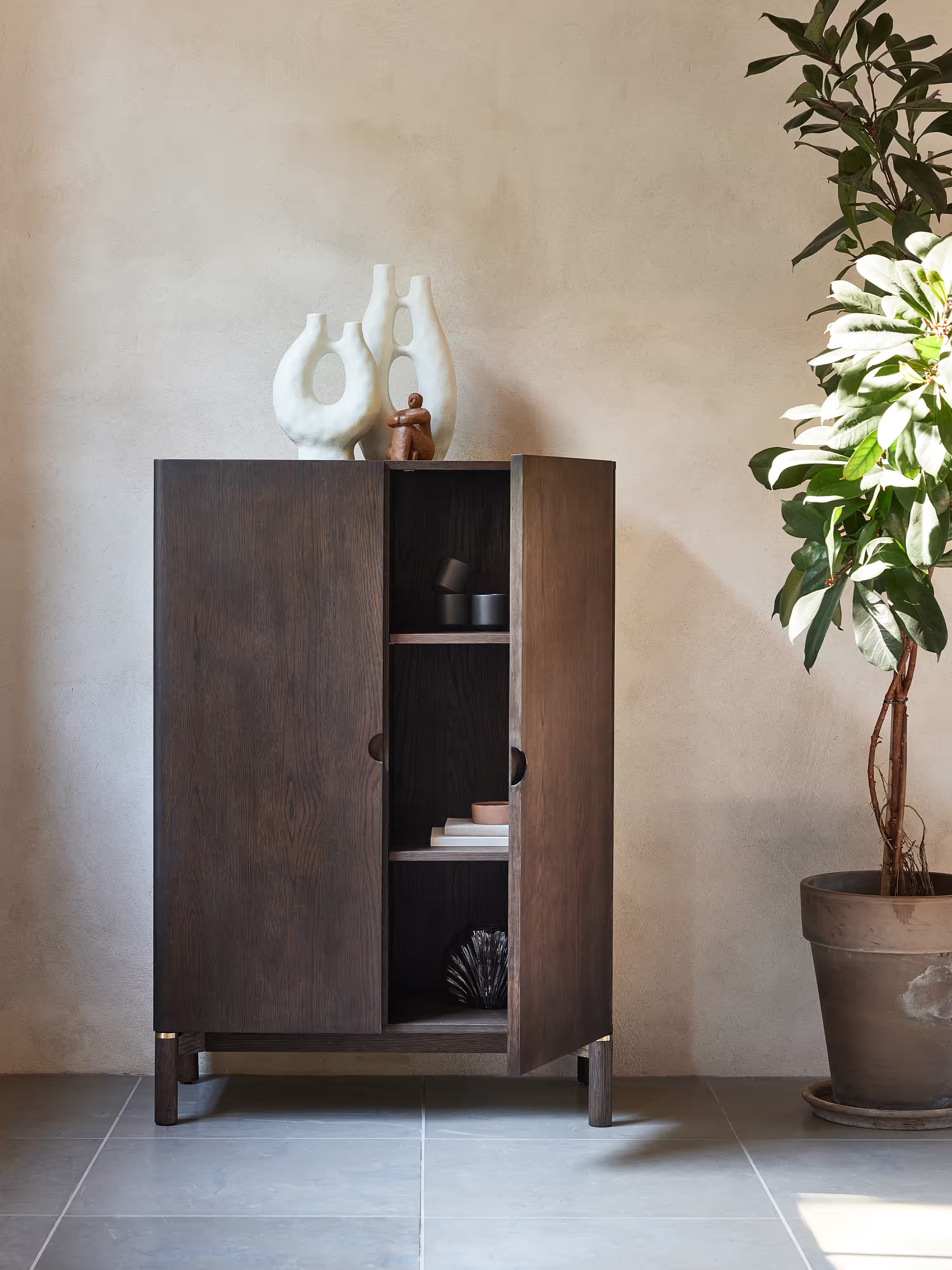 Arun Tall cabinet in dark solid wood - brass finishes 90 x 130 cm