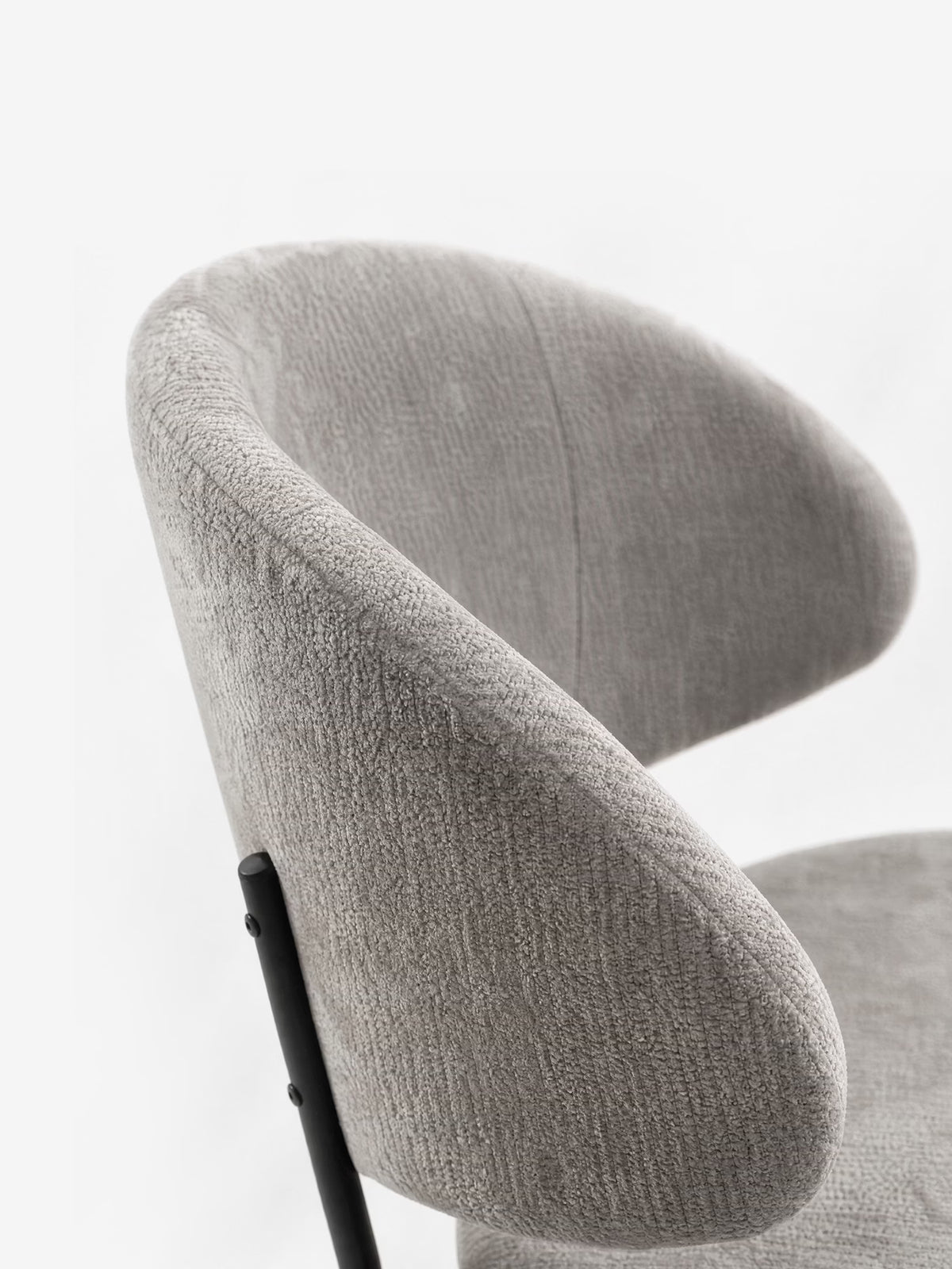 Bruma chair in elegant grey fabric with black metal legs - minimalist design and wraparound backrest