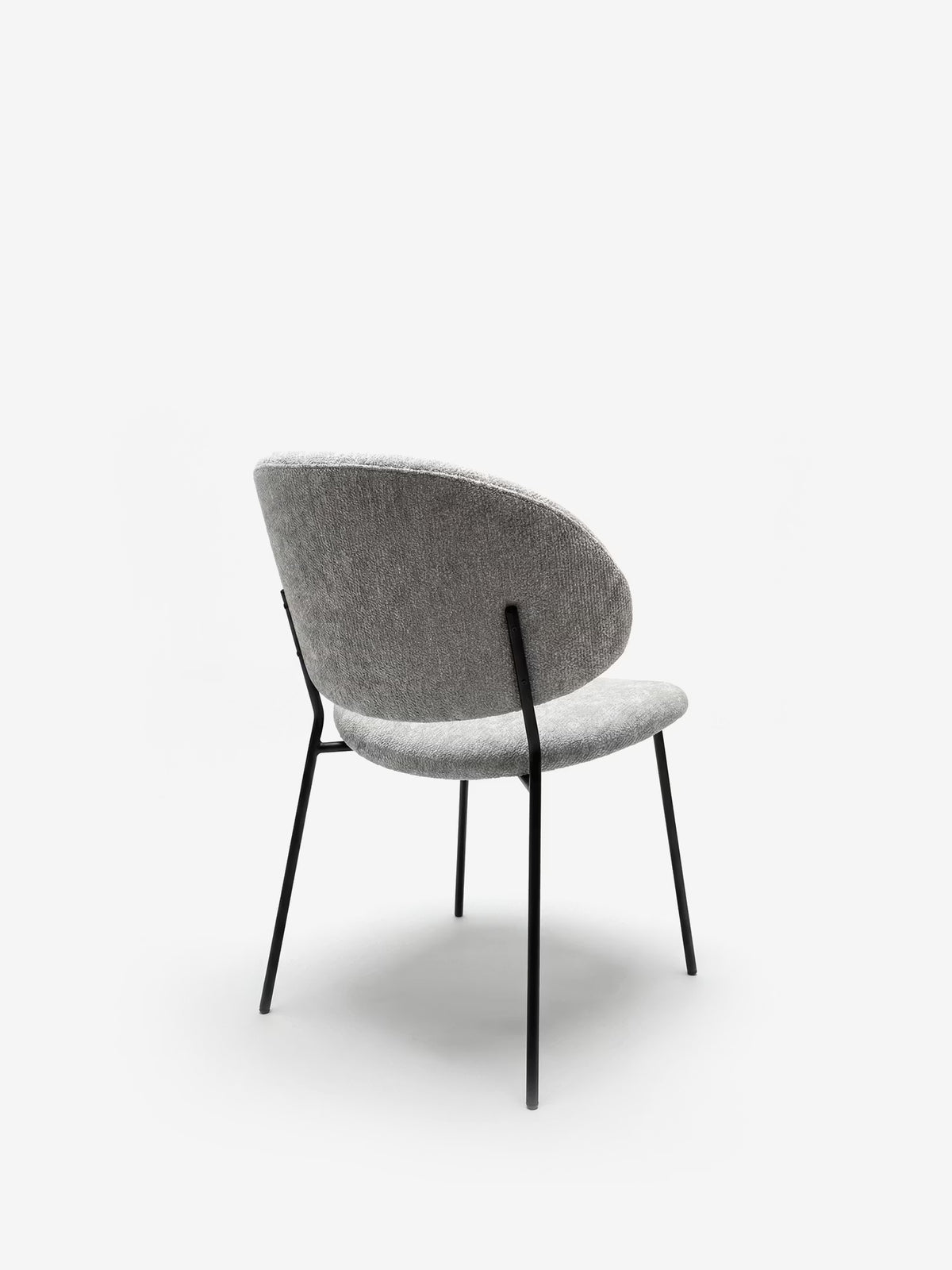 Bruma chair in elegant grey fabric with black metal legs - minimalist design and wraparound backrest