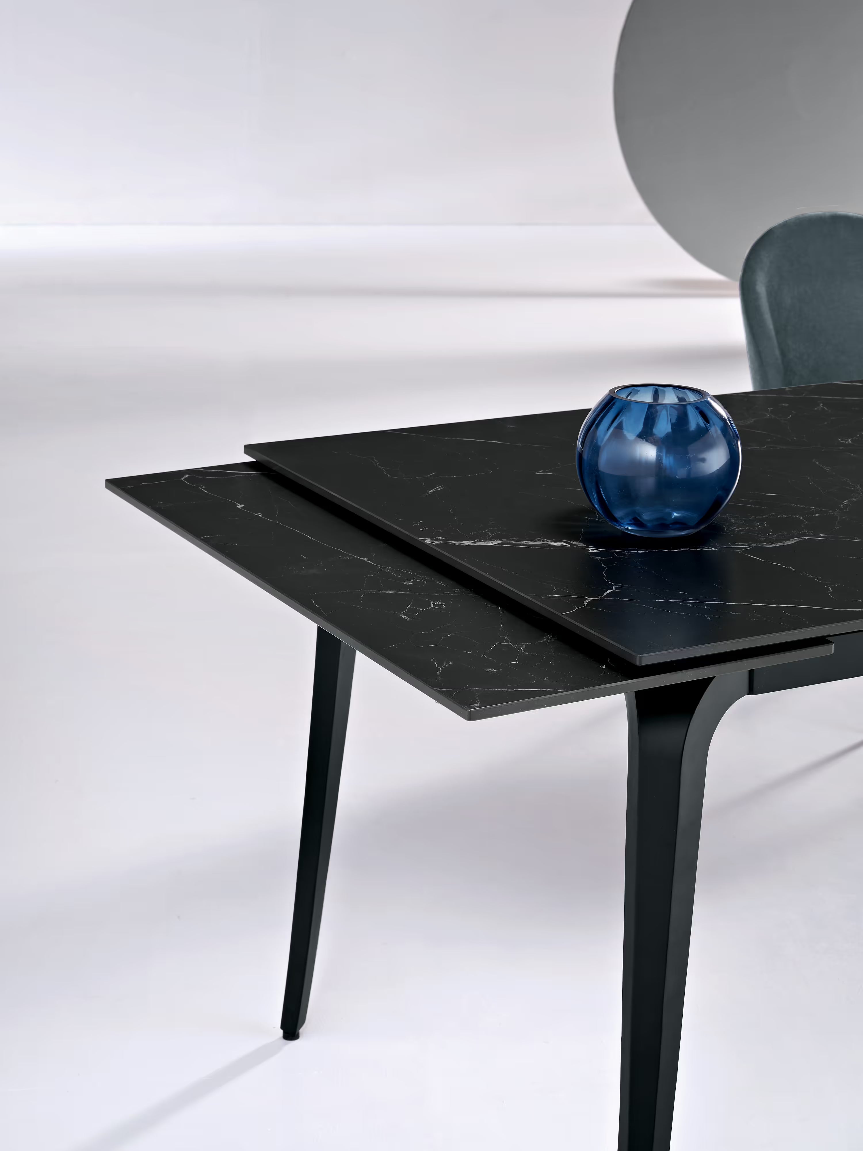 Felix extendable matte black marble table – black metal base seating 6 to 10