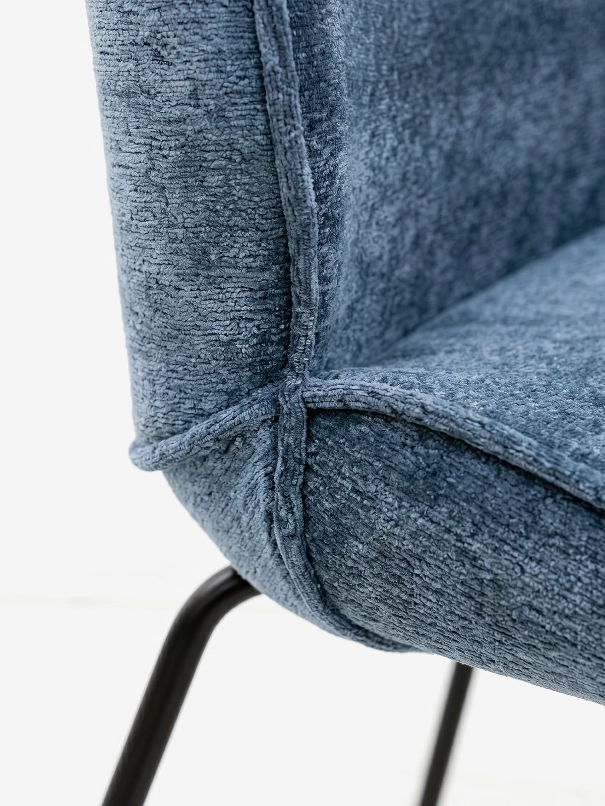 Iride upholstered chair in soft blue chenille fabric with black metal frame