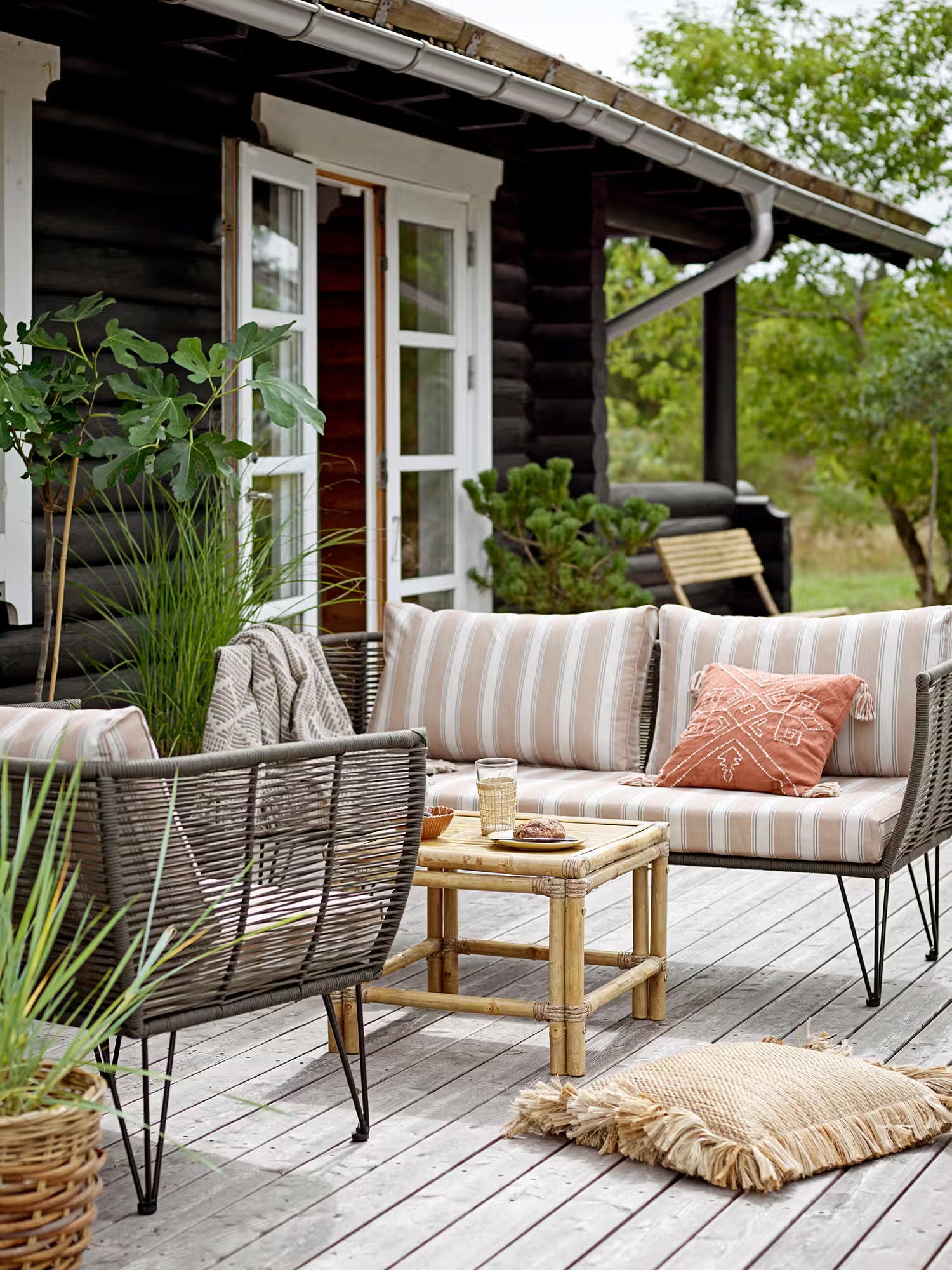 Mundo Outdoor armchair in black metal and green woven rope - striped fabric Mediterranean style