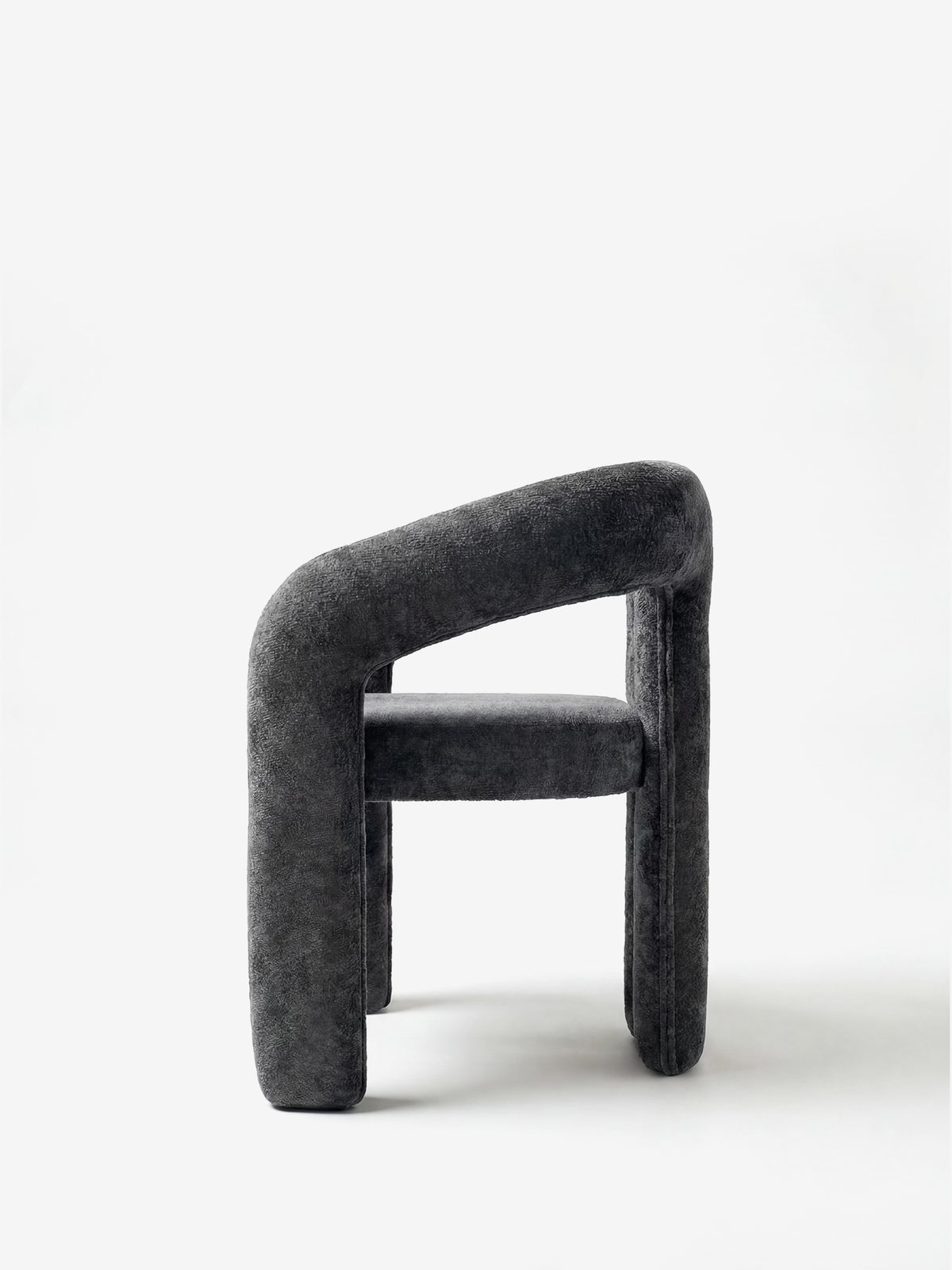 Sibilla upholstered green chenille fabric designer chair with upholstered frame and arch shape