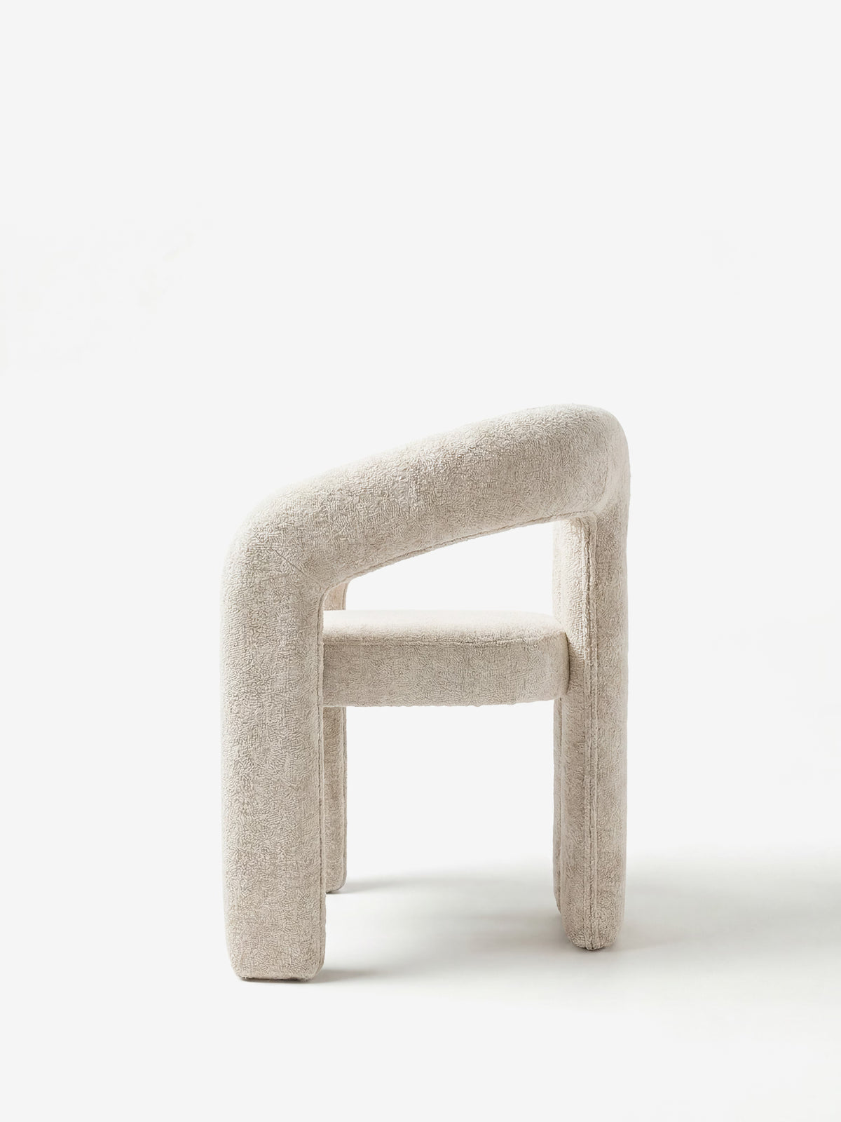 Sibilla upholstered green chenille fabric designer chair with upholstered frame and arch shape