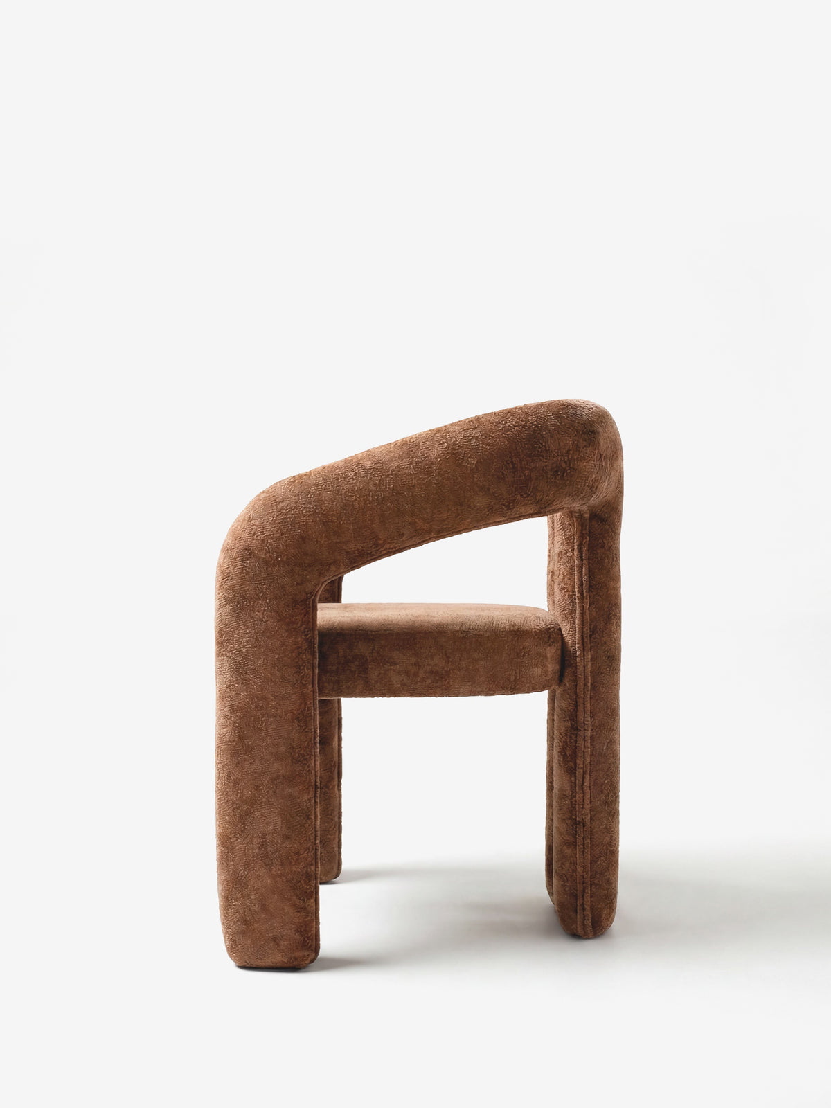 Sibilla upholstered green chenille fabric designer chair with upholstered frame and arch shape