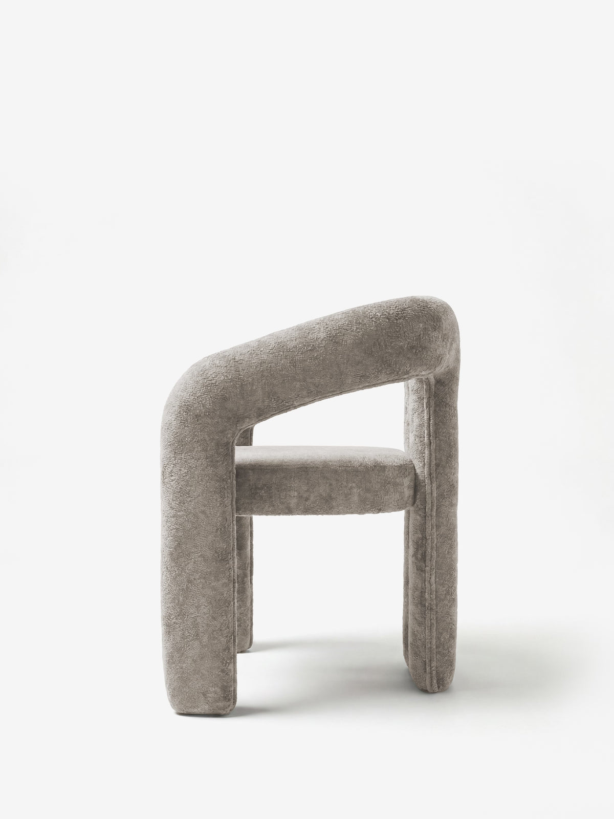 Sibilla upholstered green chenille fabric designer chair with upholstered frame and arch shape