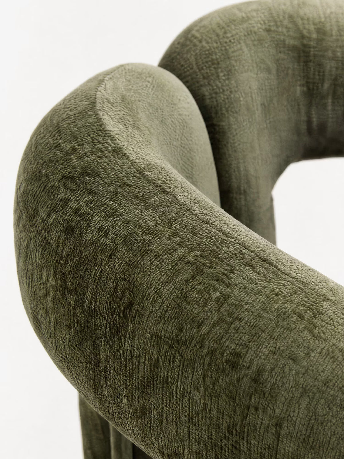 Sibilla upholstered green chenille fabric designer chair with upholstered frame and arch shape