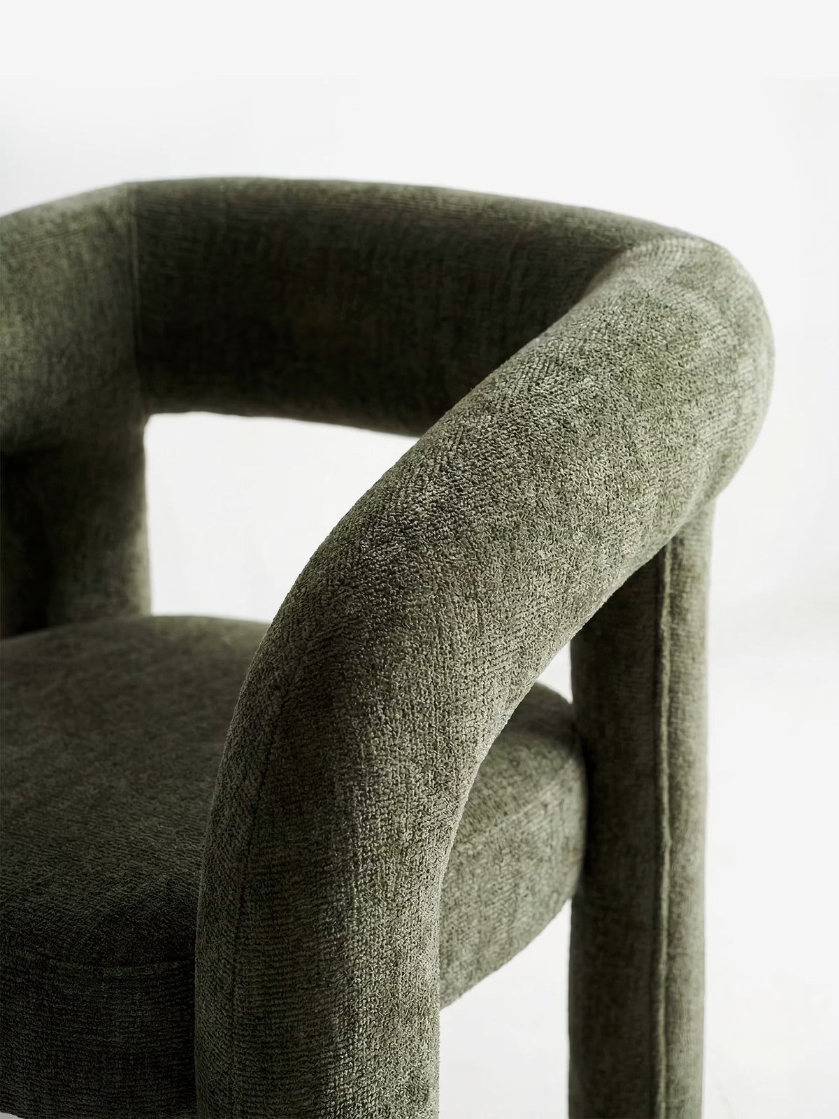 Sibilla upholstered green chenille fabric designer chair with upholstered frame and arch shape