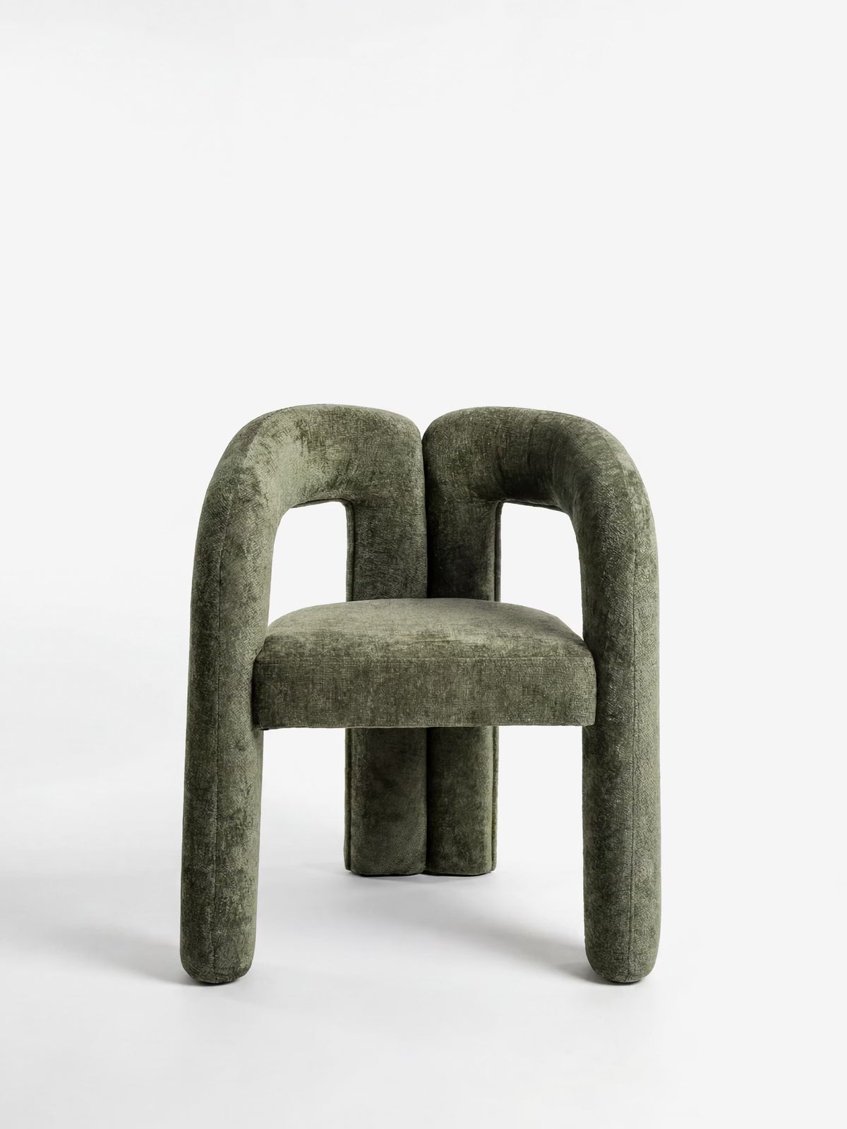 Sibilla upholstered green chenille fabric designer chair with upholstered frame and arch shape